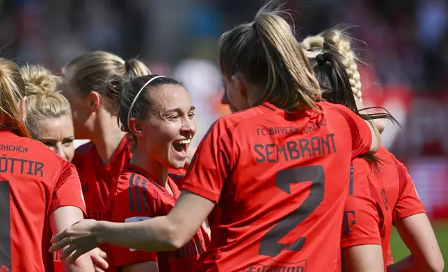 FC Bayern Munich players celebrate their championship title at the end of the Women's Bundesliga soccer match against SC Freiburg in Munich, Germany, Sunday, April 27, 2025. (Peter Kneffel/dpa via AP)