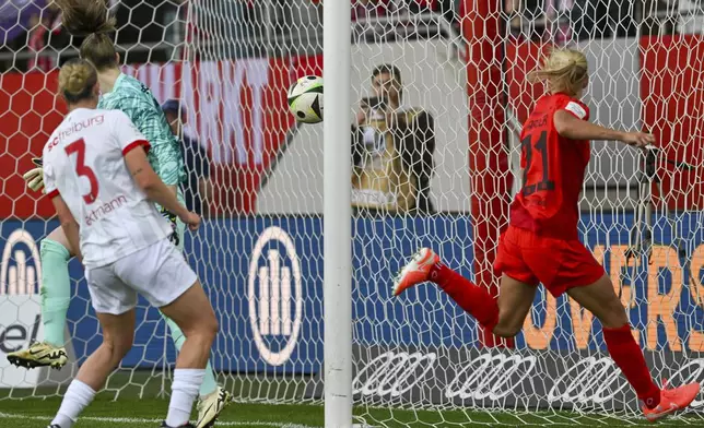 Bayern Munich's Pernille Harder, right, celebrates after scoring a goal during a Women's Bundesliga soccer match against SC Freiburg in Munich, Germany, Sunday, April 27, 2025. (Peter Kneffel/dpa via AP)