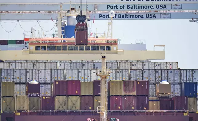 A crane lifts a container from the cargo ship Epaminondas at the Port of Baltimore, Wednesday, April 9, 2025, in Baltimore. (AP Photo/Stephanie Scarbrough)