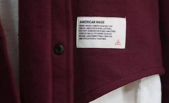 An American Giant tag is shown on clothing at the company's showroom in San Francisco, Thursday, April 17, 2025. (AP Photo/Jeff Chiu)