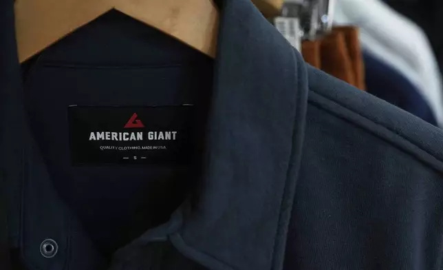 An American Giant logo is shown on clothing at the company's showroom in San Francisco, Thursday, April 17, 2025. (AP Photo/Jeff Chiu)