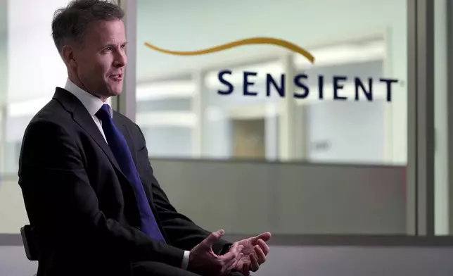 Sensient Technologies CEO Paul Manning speaks during an interview at a production facility for the color additive manufacturing company, in St. Louis., on Wednesday, April 2, 2025. (AP Photo/Jeff Roberson)