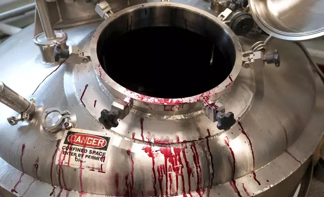 Beet juice is seen on a mixing tank used in the making of coloring at Sensient Technologies Corp., a color additive manufacturing company, in St. Louis, on Wednesday, April 2, 2025. (AP Photo/Jeff Roberson)