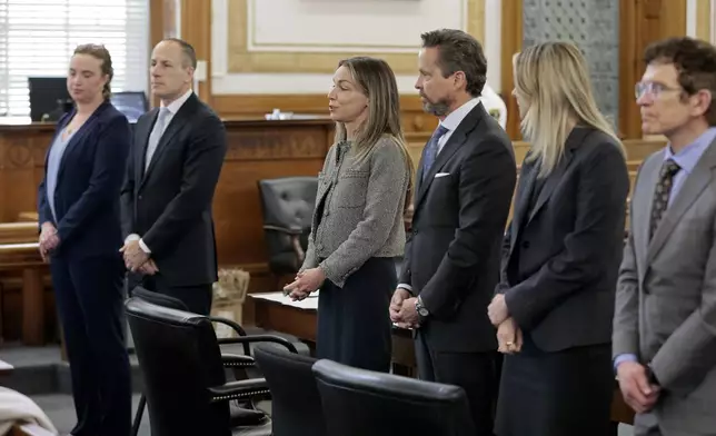 Karen Read, third left, and her defense team, Victoria George, from left, David Yannetti, Read, Alan Jackson, Elizabeth Little, and Robert Alessi introduce themselves to potential jurors as jury selection continues for the murder retrial of Read, in front of Judge Beverly J. Cannone in Norfolk Superior Court, Monday, April 14, 2025, in Dedham, Mass. (Pat Greenhouse/The Boston Globe via AP, Pool)
