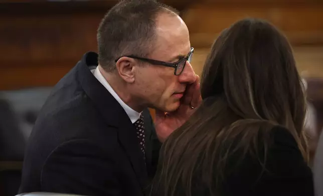 Attorney David Yannetti whispers into the ear of Karen Read during jury selection in the murder trial of Read at Norfolk Superior Court Tuesday, April 15, 2025, in Dedham, Mass. (Nancy Lane/The Boston Herald via AP, Pool)