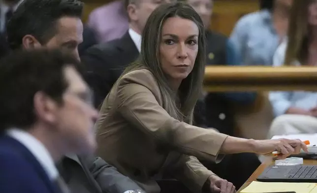 Karen Read sits with her defense team during her trial, Thursday, April 24, 2025, at Norfolk Superior Court in Dedham, Mass. (AP Photo/Charles Krupa, Pool)