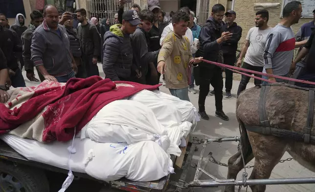 Palestinians carry the bodies of their relatives who were killed in an Israeli airstrike in Shijaiyah neighborhood, to the Baptist Hospital in Gaza City on Wednesday, April 9, 2025. (AP Photo/Jehad Alshrafi)