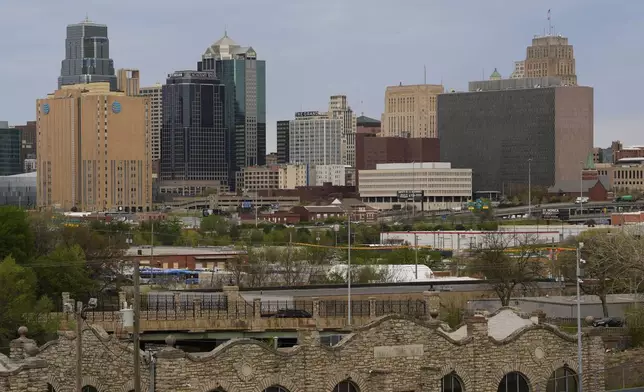 The Richard Bolling federal building is seen at right among other downtown landmarks, Monday, April 14, 2025, in Kansas City, Mo. (AP Photo/Charlie Riedel)