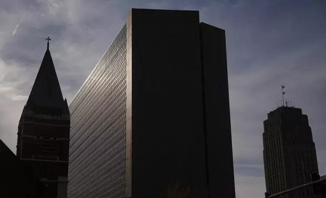 The Richard Bolling federal building, at center, rises among other downtown landmarks, Sunday, April 13, 2025, in Kansas City, Mo. (AP Photo/Charlie Riedel)