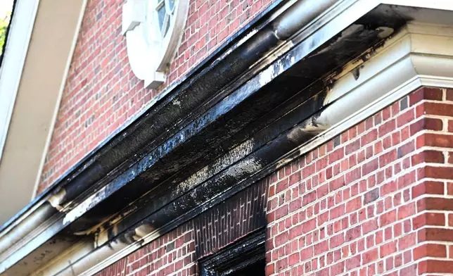 Charred wood trim and brick are visible at the Pennsylvania governor's official residence after a man was arrested in the alleged arson that forced Gov. Shapiro, his family and guests to flee in the middle of the night on the Jewish holiday of Passover, Sunday, Apr. 13, 2025, in Harrisburg, Pa. (AP Photo/Marc Levy)
