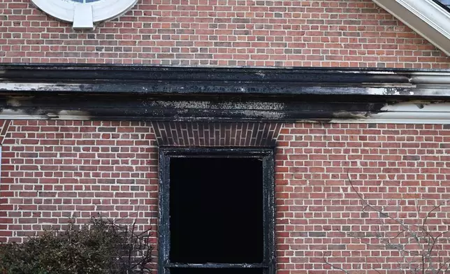 Charred wood trim and brick are visible at the Pennsylvania governor's official residence after a man was arrested in the alleged arson that forced Gov. Shapiro, his family and guests to flee in the middle of the night on the Jewish holiday of Passover, Sunday, Apr. 13, 2025, in Harrisburg, Pa. (AP Photo/Marc Levy)