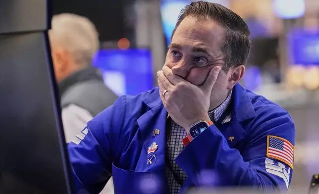 Specialist Gennaro Saporito works on the floor of the New York Stock Exchange, Wednesday, April 16, 2025. (AP Photo/Richard Drew)