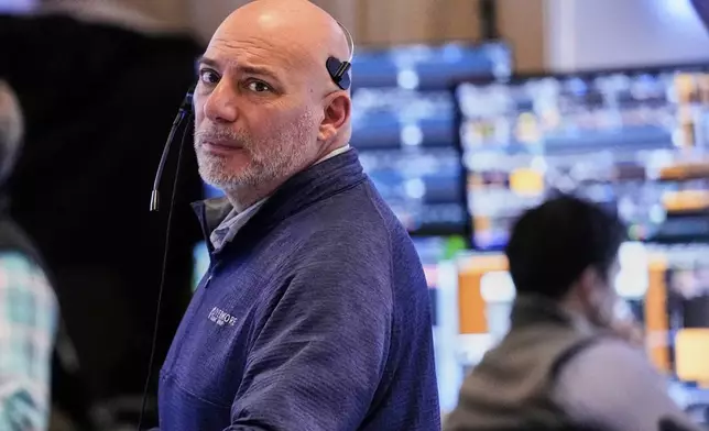 Trader Vincent Napolitano works on the floor of the New York Stock Exchange, Wednesday, April 16, 2025. (AP Photo/Richard Drew)