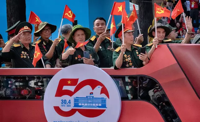 Vietnamese veterans take part in a parade during the 50th anniversary celebration of the end of the Vietnam War on Wednesday, April 30, 2025, in Ho Chi Minh City, Vietnam. (AP Photo/Richard Vogel)