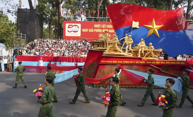 A float with structure commemorating the 50th anniversary of the end of the Vietnam War is marched during a parade in Ho Chi Minh City, Vietnam Wednesday, April 30, 2025. (AP Photo/Hau Dinh)