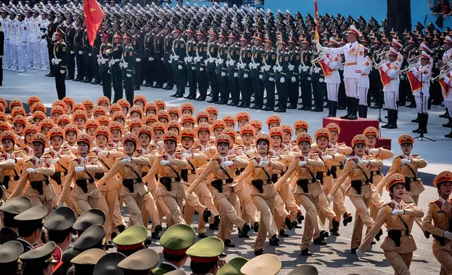 Vietnamese female police officers march during a parade celebrating the 50th anniversary of the end of the Vietnam War on Wednesday, April 30, 2025, in Ho Chi Minh City, Vietnam. (AP Photo/Richard Vogel)
