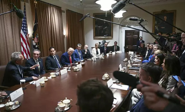 Health and Human Services Secretary Robert F. Kennedy Jr., from left, speaks as Interior Secretary Doug Burgum, Secretary of State Marco Rubio, President Donald Trump, Defense Secretary Pete Hegseth, Commerce Secretary Howard Lutnick Secretary of Education Linda McMahon, Director of the Office of Management and Budget Russell Vought and White House National Security Adviser Mike Waltz listen during a cabinet meeting in the Cabinet Room of the White House, Thursday, April 10, 2025, in Washington. (Pool via AP)
