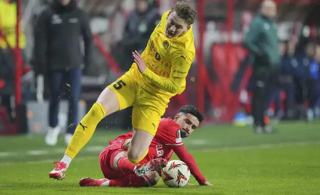 FILE - Twente's Naci Unuvar tackles Glimt's Isak Dybvik Maatta during the Europa League play-off match between Twente and Bodo Glimt in Enschede, Netherlands, Thursday, Feb. 13, 2025. (AP Photo/Peter Dejong, File)