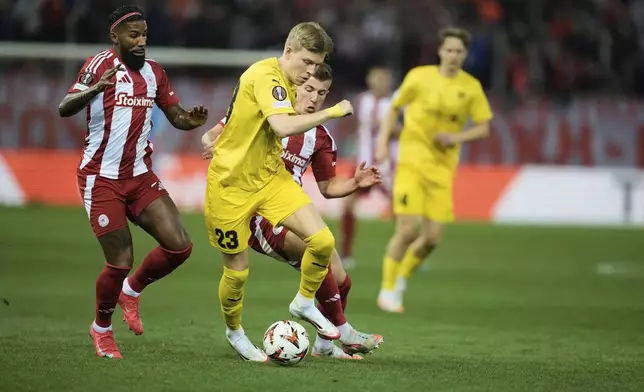 FILE - Glimt's Jens Petter Hauge, front, Olympiacos' Costinha, rear right, and Olympiacos' Gelson Martins, left, vie for the ball during the Europa League round of 16 second leg soccer match between Olympiacos FC and FK Bodo/Glimt at the Georgios Karaiskakis stadium at Athens' port of Piraeus, Greece, Thursday, March 13, 2025. (AP Photo/Thanassis Stavrakis, File)