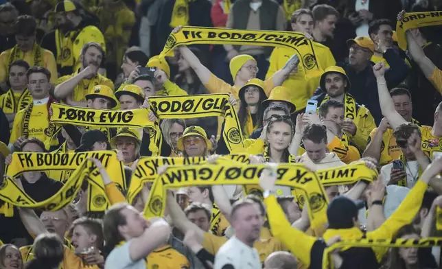 FILE - Glimt fans cheer before the Europe League quarter final second leg match between Lazio and Bodo Glimt in Rome, Italy, Thursday, April 17, 2025. (AP Photo/Alessandra Tarantino, File)