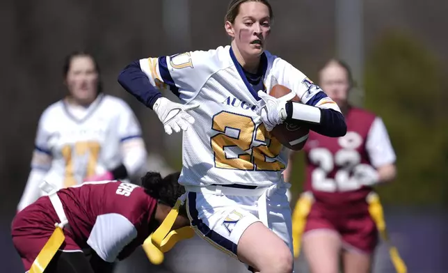 Augustana University and Concordia University, St. Paul players compete during a women's college flag football game, April 7, 2025, in St. Paul. Minn. (AP Photo/Abbie Parr)