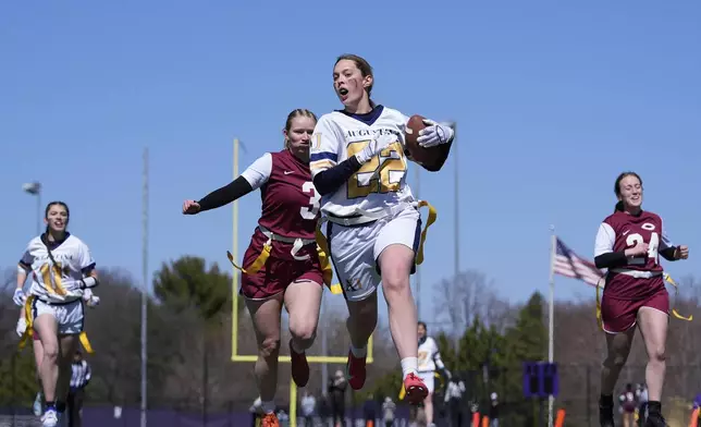 Augustana University and Concordia University, St. Paul players compete during a women's college flag football game, April 7, 2025, in St. Paul. Minn. (AP Photo/Abbie Parr)