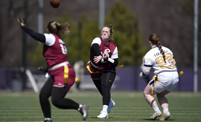 Augustana University and Concordia University, St. Paul players compete during a women's college flag football game, April 7, 2025, in St. Paul. Minn. (AP Photo/Abbie Parr)