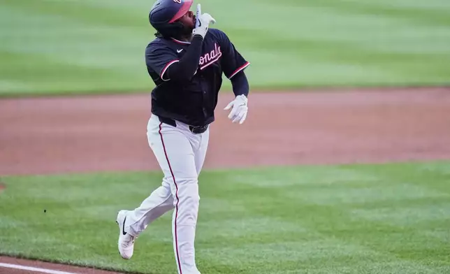 Washington Nationals' Josh Bell celebrates after hitting a two-run home run during the first inning of a baseball game against the Baltimore Orioles, Wednesday, April 23, 2025, in Washington. (AP Photo/Stephanie Scarbrough)