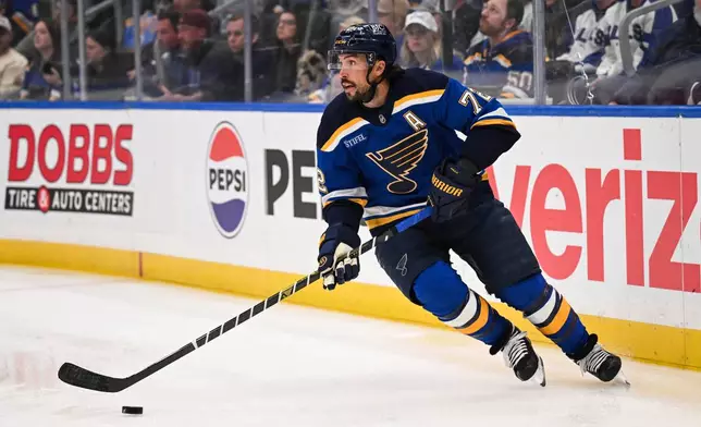 St. Louis Blues' Justin Faulk controls the puck against the Winnipeg Jets during the first period in Game 4 of an NHL hockey first-round playoff series Sunday, April 27, 2025, in St. Louis. (AP Photo/Connor Hamilton)