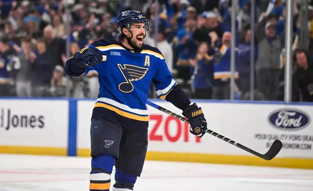 St. Louis Blues' Justin Faulk reacts after scoring against the Winnipeg Jets during the second period in Game 4 of an NHL hockey first-round playoff series Sunday, April 27, 2025, in St. Louis. (AP Photo/Connor Hamilton)