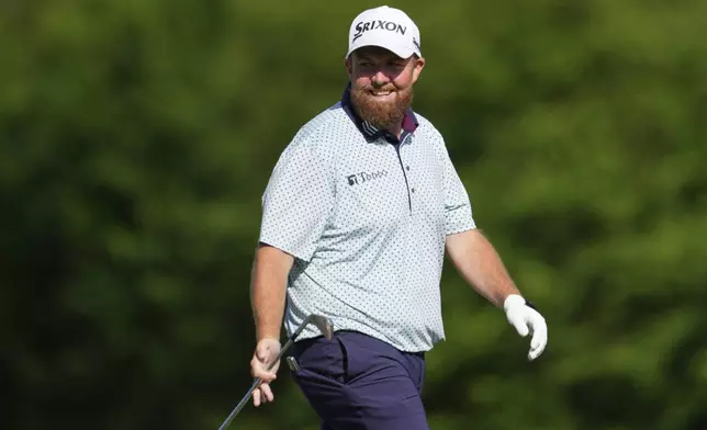 Shane Lowry, of Ireland, smiles on the 12th hole during the third round at the Masters golf tournament, Saturday, April 12, 2025, in Augusta, Ga. (AP Photo/Matt Slocum)