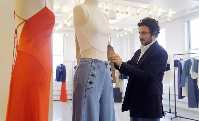 Designer Zac Posen appears with his new clothing line at the Gap corporate office on Tuesday, March 25, 2025, in New York. (Photo by Charles Sykes/Invision/AP)