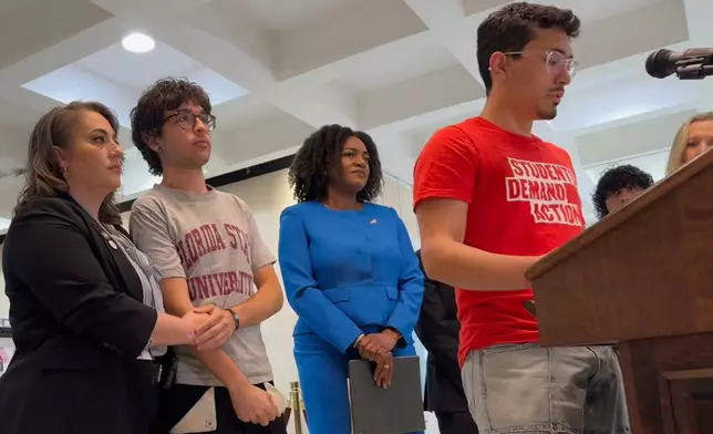 Andres Perez, a 20-year-old junior at Florida State University, speaks at a nes conference in the state capitol in Tallahassee, Fla. alongside Democratic lawmakers on Tuesday, April 22, 2025. (AP Photo/Kate Payne)