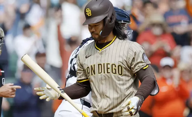 San Diego Padres' Connor Joe flips his bat after striking out to end the baseball game against the Detroit Tigers, Wednesday, April 23, 2025, in Detroit. (AP Photo/Duane Burleson)