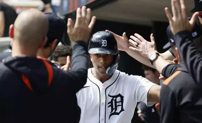 Detroit Tigers'Justyn-Henry Malloy celebrates with teammates after scoring against the San Diego Padres during the seventh inning of a baseball game, Wednesday, April 23, 2025, in Detroit. (AP Photo/Duane Burleson)
