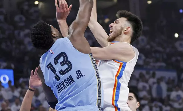 Oklahoma City Thunder forward Chet Holmgren (7) looks to shoot over Memphis Grizzlies forward Jaren Jackson Jr. (13) during the first half in Game 1 of an NBA first-round playoff series, Sunday, April 20, 2025, in Oklahoma City. (AP Photo/Nate Billings)