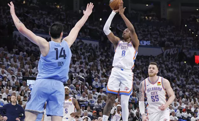 Oklahoma City Thunder forward Jalen Williams (8) looks to shoot over Memphis Grizzlies center Zach Edey (14) as Thunder center Isaiah Hartenstein (55) looks on during the first half in Game 1 of an NBA first-round playoff series, Sunday, April 20, 2025, in Oklahoma City. (AP Photo/Nate Billings)