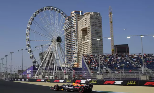 Red Bull driver Yuki Tsunoda of Japan steers his car during the third free practice ahead of the Formula One Saudi Arabian Grand Prix at the Jeddah Corniche Circuit in Jeddah, Saudi Arabia, Saturday, April 19, 2025. (AP Photo/Altaf Qadri)