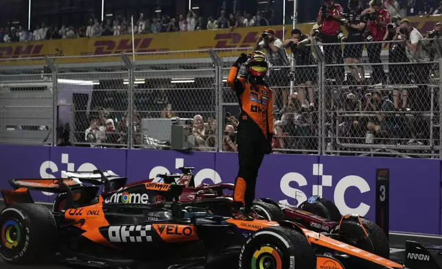 McLaren driver Oscar Piastri of Australia celebrates after winning the Formula One Saudi Arabian Grand Prix at the Jeddah Corniche Circuit in Jeddah, Saudi Arabia, Sunday, April 20, 2025. (AP Photo/Altaf Qadri)