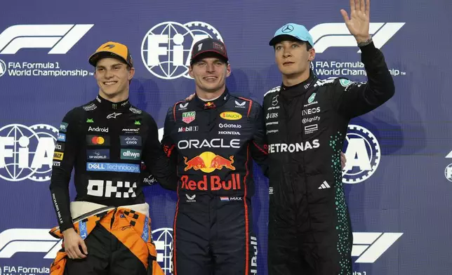 Red Bull driver Max Verstappen of the Netherlands, center, pole position, is flanked by McLaren driver Oscar Piastri of Australia, left, second fastest time and Mercedes driver George Russell of Britain, third fastest time after the qualifying session ahead of the Formula One Saudi Arabian Grand Prix at the Jeddah Corniche Circuit in Jeddah, Saudi Arabia, Saturday, April 19, 2025. (AP Photo/Darko Bandic)