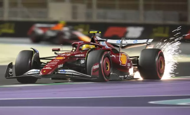 Ferrari driver Lewis Hamilton of Britain steers his car during the qualifying session ahead of the Formula One Saudi Arabian Grand Prix at the Jeddah Corniche Circuit in Jeddah, Saudi Arabia, Saturday, April 19, 2025. (AP Photo/Altaf Qadri)
