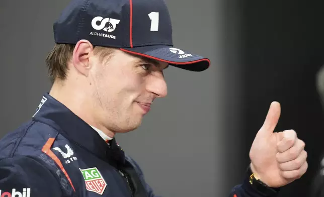 Red Bull driver Max Verstappen of the Netherlands thumbs up after setting the pole position in the qualifying session ahead of the Formula One Saudi Arabian Grand Prix at the Jeddah Corniche Circuit in Jeddah, Saudi Arabia, Saturday, April 19, 2025. (AP Photo/Darko Bandic)