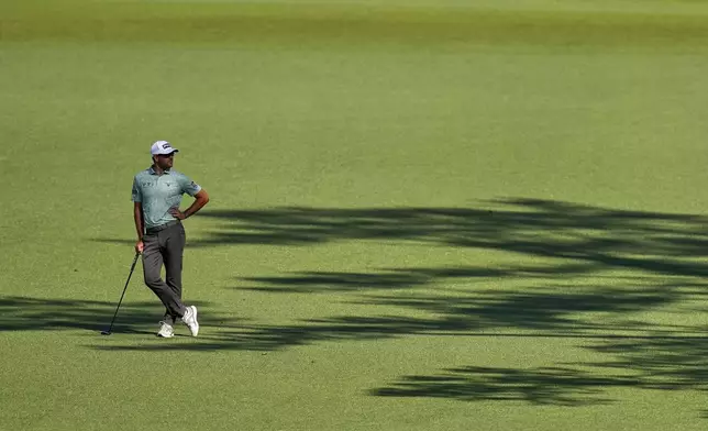 Corey Conners, of Canada, waits to play on the 15th hole during the second round at the Masters golf tournament, Friday, April 11, 2025, in Augusta, Ga. (AP Photo/David J. Phillip)