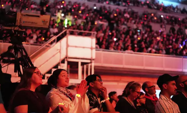 Fans react to the opening act during the Star Wars Celebration in Chiba, near Tokyo, Friday, April 18, 2025. (AP Photo/Hiro Komae)