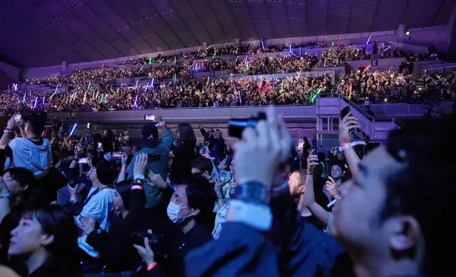 Fans react to the opening act during the Star Wars Celebration in Chiba, near Tokyo, Friday, April 18, 2025. (AP Photo/Hiro Komae)