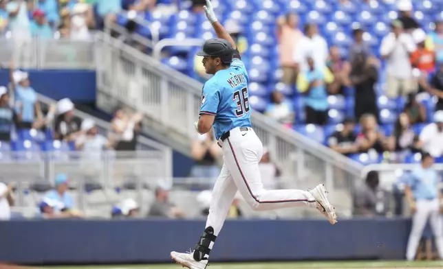 Miami Marlins' Matt Mervis (36) runs the bases after hitting a three-run home run during the seventh inning of a baseball game against the Washington Nationals, Sunday, April 13, 2025, in Miami. (AP Photo/Lynne Sladky)