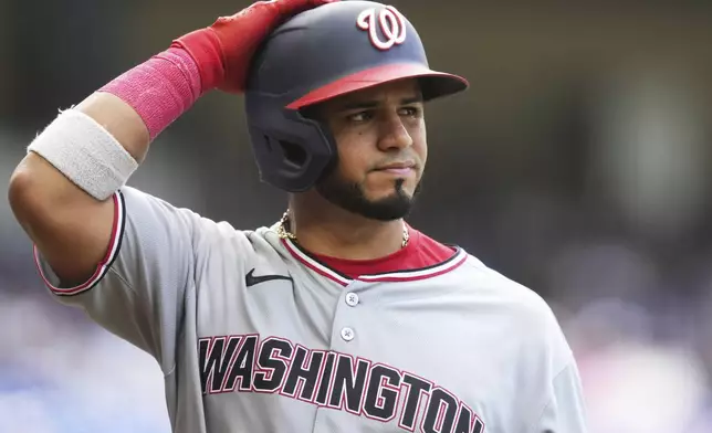 Washington Nationals' Keibert Ruiz reacts after flying out during the seventh inning of a baseball game against the Miami Marlins, Sunday, April 13, 2025, in Miami. (AP Photo/Lynne Sladky)