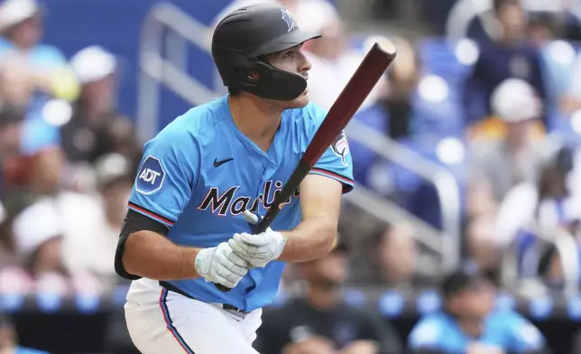 Miami Marlins' Matt Mervis watches after hitting a two run home run during the seventh inning of a baseball game against the Washington Nationals, Sunday, April 13, 2025, in Miami. (AP Photo/Lynne Sladky)