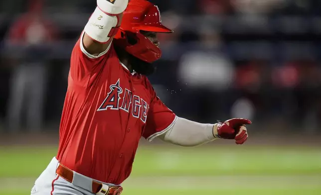 Los Angeles Angels' Luis Rengifo celebrates his RBI single off Tampa Bay Rays pitcher Pete Fairbanks during the ninth inning of a baseball game Tuesday, April 8, 2025, in Tampa, Fla. (AP Photo/Chris O'Meara)