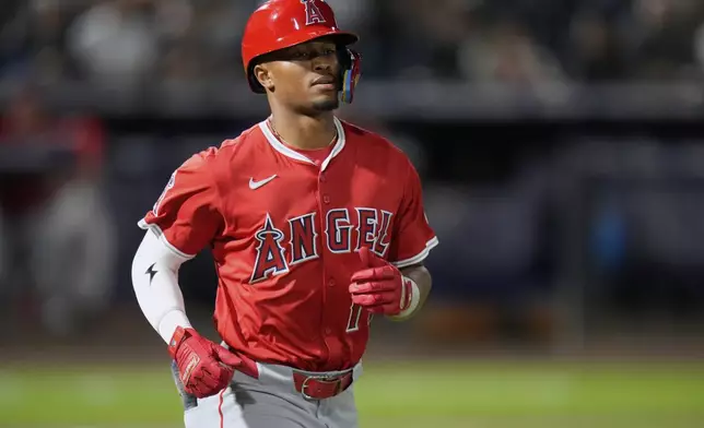 Los Angeles Angels' Kyren Paris heads for first base after drawing a walk from Tampa Bay Rays pitcher Shane Baz during the seventh inning of a baseball game Tuesday, April 8, 2025, in Tampa, Fla. (AP Photo/Chris O'Meara)